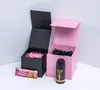 Two open gift boxes, one black and one pink, with shredded paper filling. A granola bar and a deodorant stick are placed in front of the boxes. Náhled obrázku produktu