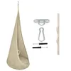 A beige hanging chair with its mounting hardware and a wooden support piece, all displayed against a white background. Náhľad obrázku produktu