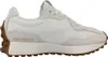 A side view of a New Balance sneaker. Voir les images du produit
