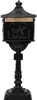 A black cast iron mailbox on a pedestal, isolated on a white background. Voir les images du produit