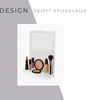 A white shelf with various makeup products and a mirror. Produktbild-Vorschau