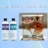 Two bottles of epoxy resin are shown next to a clear cube containing preserved flowers, with text overlay. Voir les images du produit