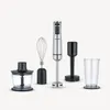 An assortment of kitchen blender attachments and a hand blender are displayed against a white background. Produktbild-Vorschau