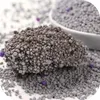 A close-up of clumping cat litter, with some purple beads mixed in. Podgląd zdjęcia produktu