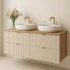 A modern bathroom vanity with two sinks and gold faucets. Náhľad obrázku produktu