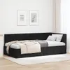 A black velvet corner bed frame with a headboard, made up with white bedding and a beige throw blanket. Produktbild-Vorschau