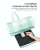 A picnic blanket is shown partially unrolled, with a hand holding a stake. Produktbild-Vorschau