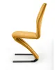 A side view of a modern yellow dining chair with black legs against a white background. Produktbild-Vorschau