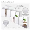 Instructions on how to hang a mirror cabinet, showing wall mounting and a detail of the hanging groove and bracket. Voir les images du produit