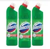 Three green bottles of Domestos cleaner are displayed side-by-side against a white background. Podgląd zdjęcia produktu