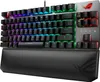 A close-up, angled view of a black mechanical keyboard with RGB lighting and a black wrist rest. Produktbild-Vorschau