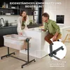 A couple in a modern kitchen setting, with a baby bassinet next to them. Náhľad obrázku produktu