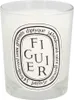 A close-up shot of a Diptyque scented candle in a glass jar with a label. Anteprima dell’immagine prodotto