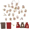 A collection of wooden Christmas-themed ornaments and small fabric bags for an advent calendar. Podgląd zdjęcia produktu