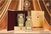 A product shot of two perfume bottles and their packaging, set against a luxurious gold and brown draped background. Anteprima dell’immagine prodotto