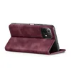 A burgundy flip case for a smartphone is shown in a side-view, propped open. Produktbild-Vorschau