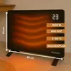 A black electric heater with an orange glowing element is shown on a wooden floor, with dimensions indicated. Anteprima dell’immagine prodotto