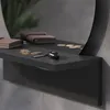 A close-up view of a shelf with a mirror in the background, holding a wallet, keys, and coins. Produktbild-Vorschau