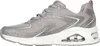 A side view of a single silver and white sneaker. Voir les images du produit