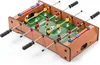 A miniature foosball table with red and yellow players, a soccer ball, and score markers. Podgląd zdjęcia produktu