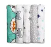 A set of rolled-up baby muslin cloths with different patterns, laid out side-by-side against a white background. Produktbild-Vorschau