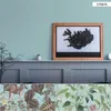 A collage of wallpaper samples and a framed map of Iceland. Produktbild-Vorschau