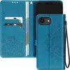 A teal blue wallet-style phone case with a mandala design is shown open, revealing card slots and a phone holder. The phone itself is not visible. Podgląd zdjęcia produktu