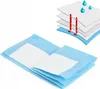 A stack of pet training pads with an inset diagram showing their layered structure and absorbency. Produktbild-Vorschau