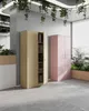 Two metal filing cabinets, one beige and one pink, in an office setting with plants and blinds. Anteprima dell’immagine prodotto