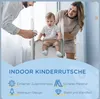 A family is interacting with a baby on a small indoor slide. Náhled obrázku produktu