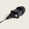 A close-up of a black power adapter with a cable plugged into it. Náhled obrázku produktu