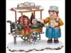 A miniature Christmas decoration depicting a person serving punch from a cart. Produktbild-Vorschau