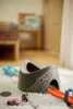 A toy car track set with a tunnel is laid out on a rug in a room. Náhľad obrázku produktu
