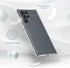 A clear phone case is shown at an angle on a light gray and white background with soft lighting and feather accents. Produktbild-Vorschau