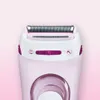 A close-up shot of the top part of a pink and white electric shaver. Náhled obrázku produktu