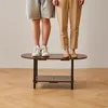 Two people standing on a coffee table. Náhled obrázku produktu