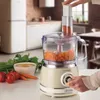A kitchen scene with a food processor in use, surrounded by fresh ingredients. Náhľad obrázku produktu