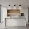 A modern, minimalist kitchen with white cabinets, a large island, and built-in appliances. Podgląd zdjęcia produktu