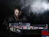 A man in a hockey jersey leans over a table hockey game. Náhľad obrázku produktu