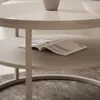 A close-up view of a two-tiered coffee table with a magazine on the lower shelf. Produktbild-Vorschau
