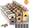A collection of clear plastic food storage containers filled with various dry goods and pasta, arranged in a stepped pattern. A set of measuring cups and a chalk are also visible. Produktbild-Vorschau