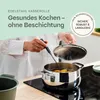 A person is cooking with a stainless steel pot on a stovetop. Produktbild-Vorschau