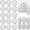 A collection of white plastic socket covers and a white plastic key for removing them, shown against a white background. A single socket cover is shown inserted into a white electrical socket. Anteprima dell’immagine prodotto
