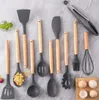 A collection of kitchen utensils laid out on a gray surface. Náhľad obrázku produktu