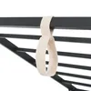 A close-up of a beige strap hanging from a black metal frame. Produktbild-Vorschau
