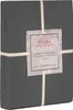 A folded duvet cover is packaged with a label attached by string. Produktbild-Vorschau