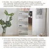 A white shoe cabinet with a mirror is shown next to a large potted plant. The cabinet has multiple shelves for shoes, and text describes its features. Produktbild-Vorschau