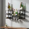 A wall-mounted wine rack with bottles and glasses displayed. Produktbild-Vorschau