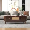 A living room scene with a couch, coffee table, and artwork. Voir les images du produit