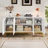 A white sideboard with gold legs and handles, featuring open doors revealing shelves with various decorative items and storage boxes. Anteprima dell’immagine prodotto